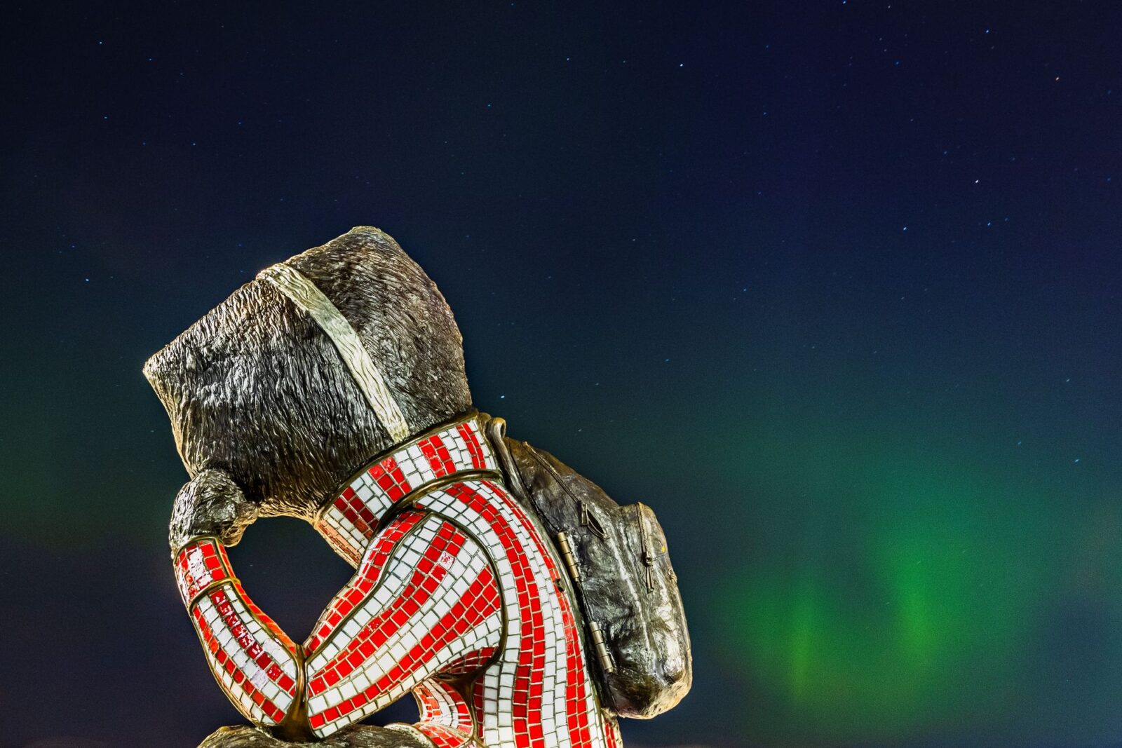 "Well Red" Statue of Bucky Badger watches the Norther Lights